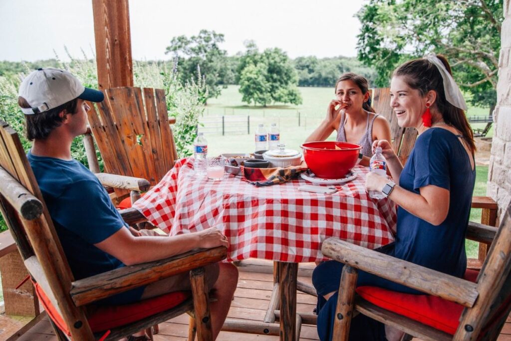 Family eating outside porch