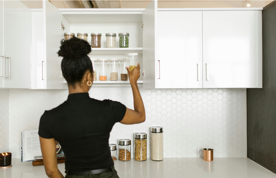 Woman organizing cupboard